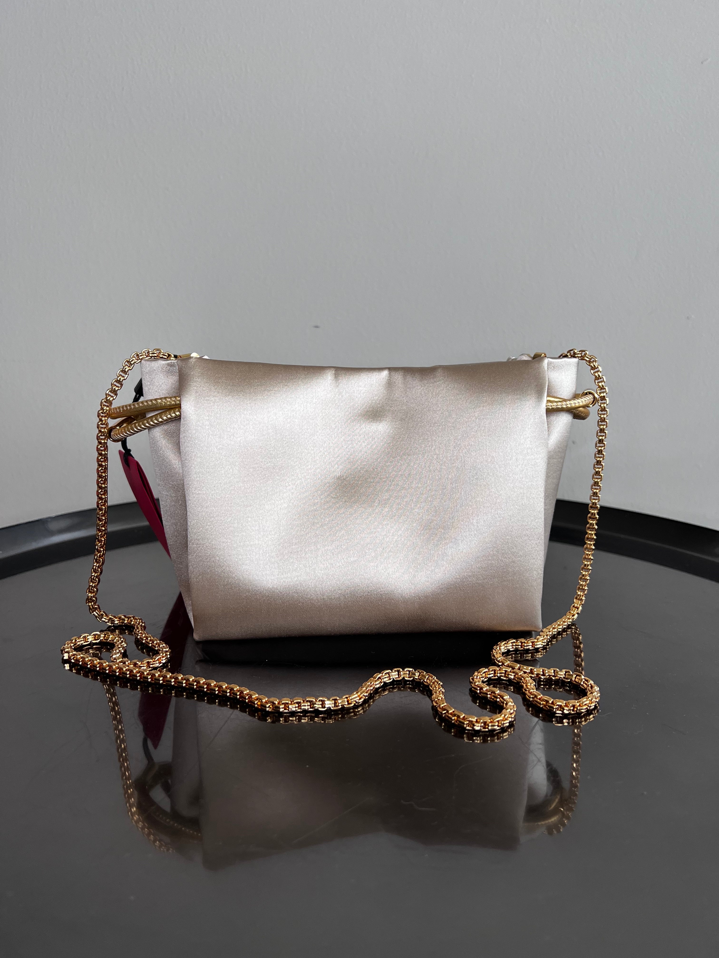 Brand New !! Initials Insignia Soft Bucket small cross body bag in gold beige - CAROLINA HERRERA