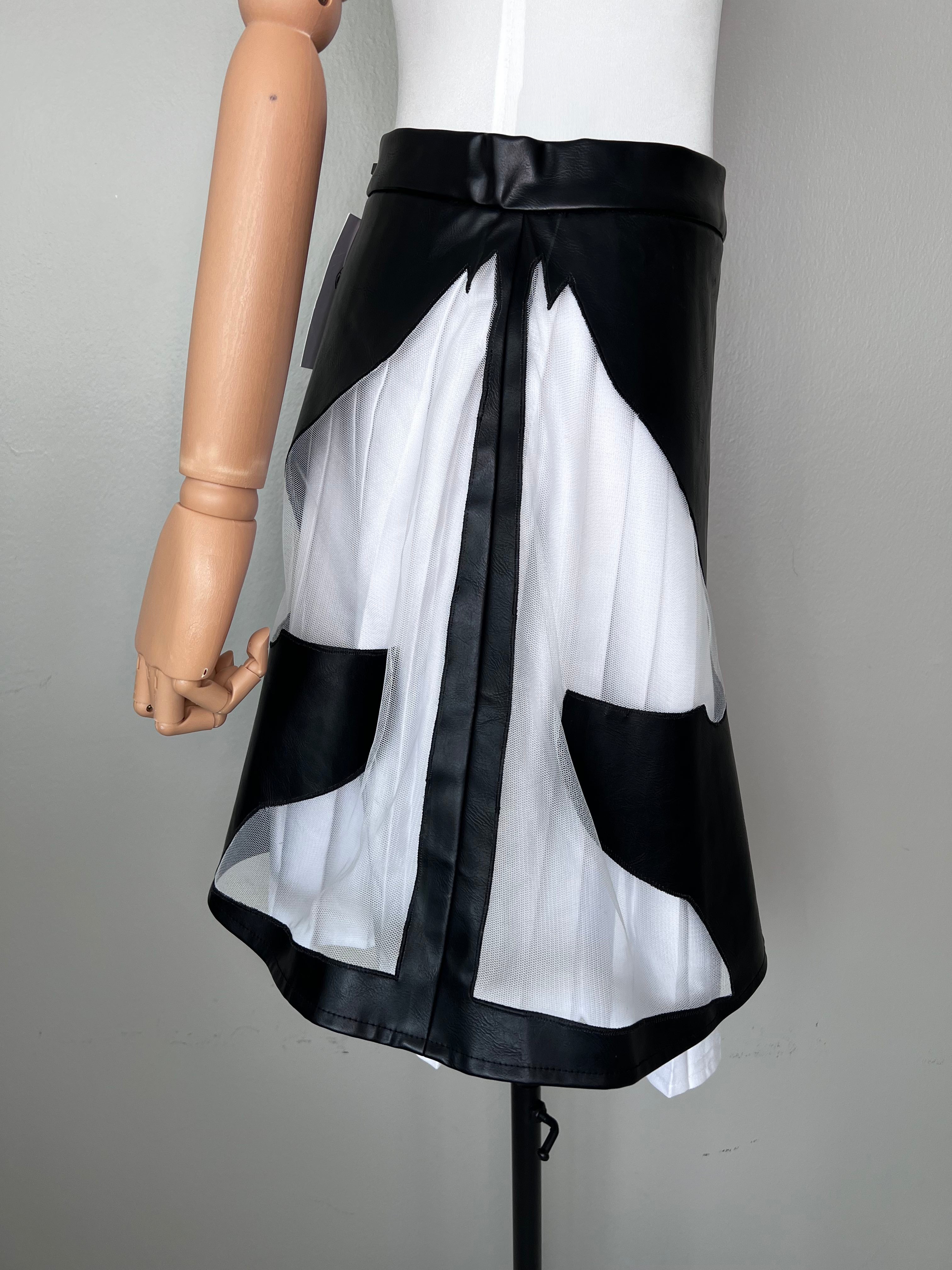 Short pleated white underskirt with leather skirt that has a horse cut out on the side. - MAMZI.