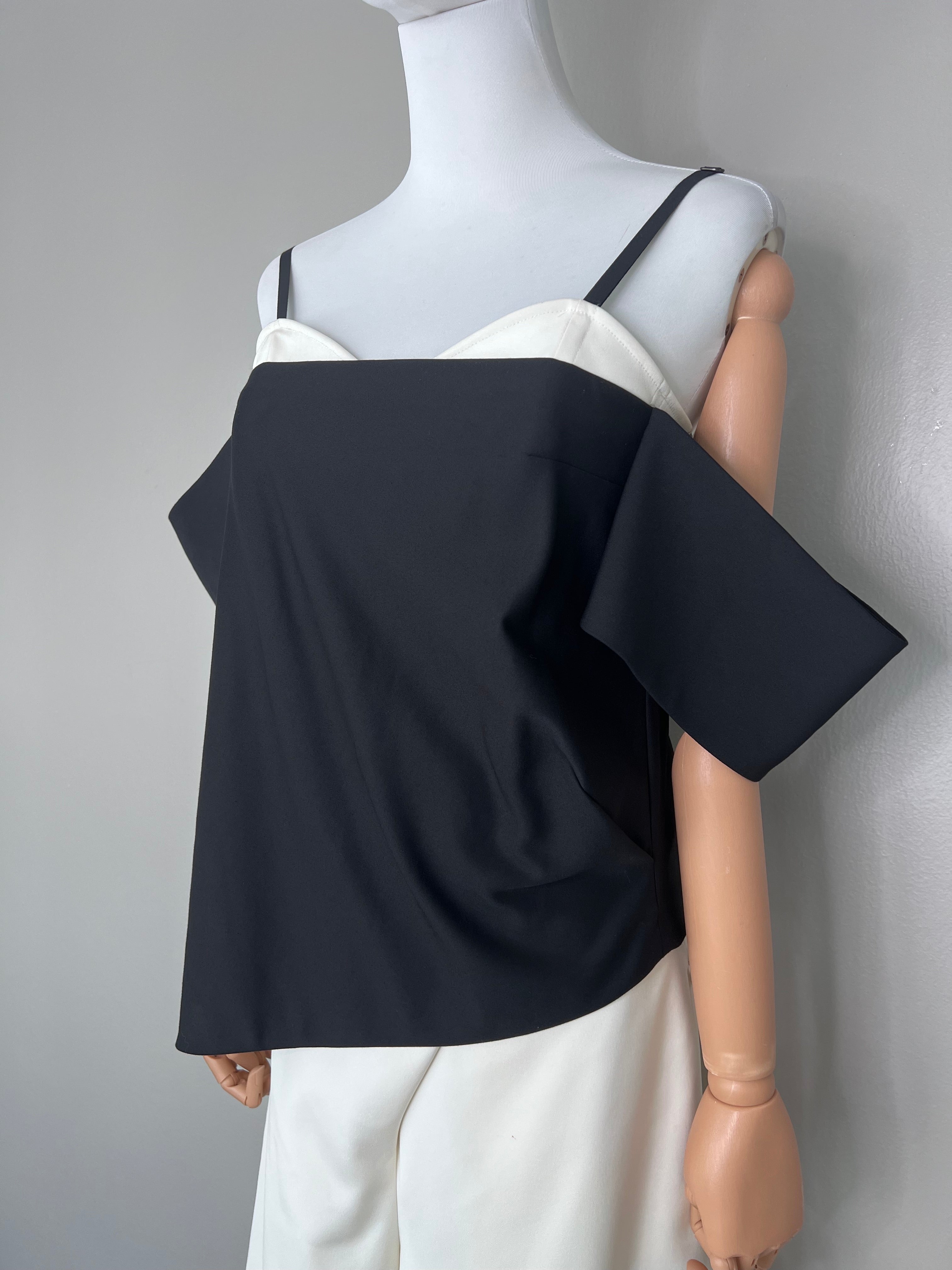 A set of Black halter off-shoulder top with white crossover wide-leg dress pants- TIBI