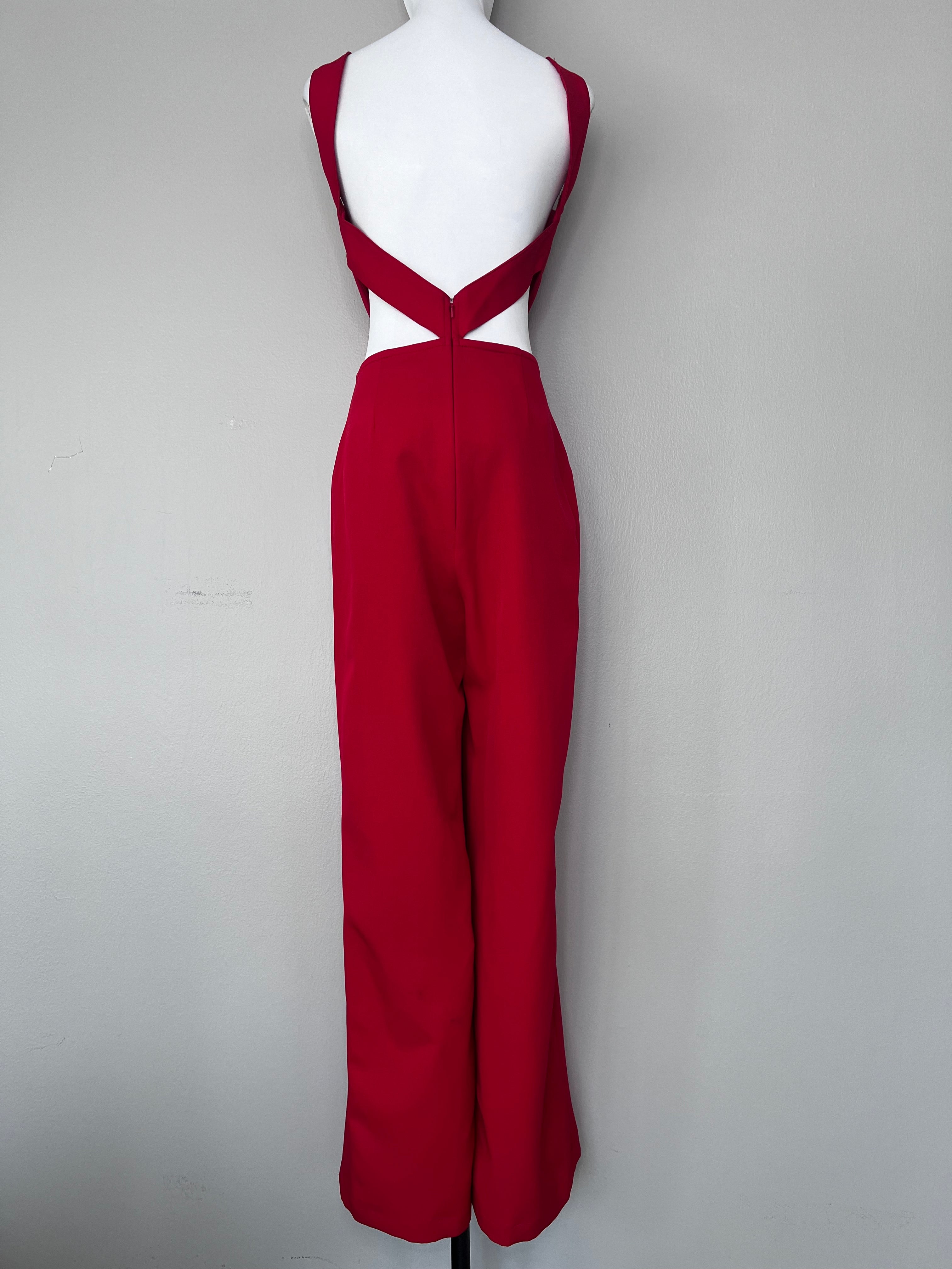 Red jumpsuit with cut outs at rib/waist. - DEE BY DALIA