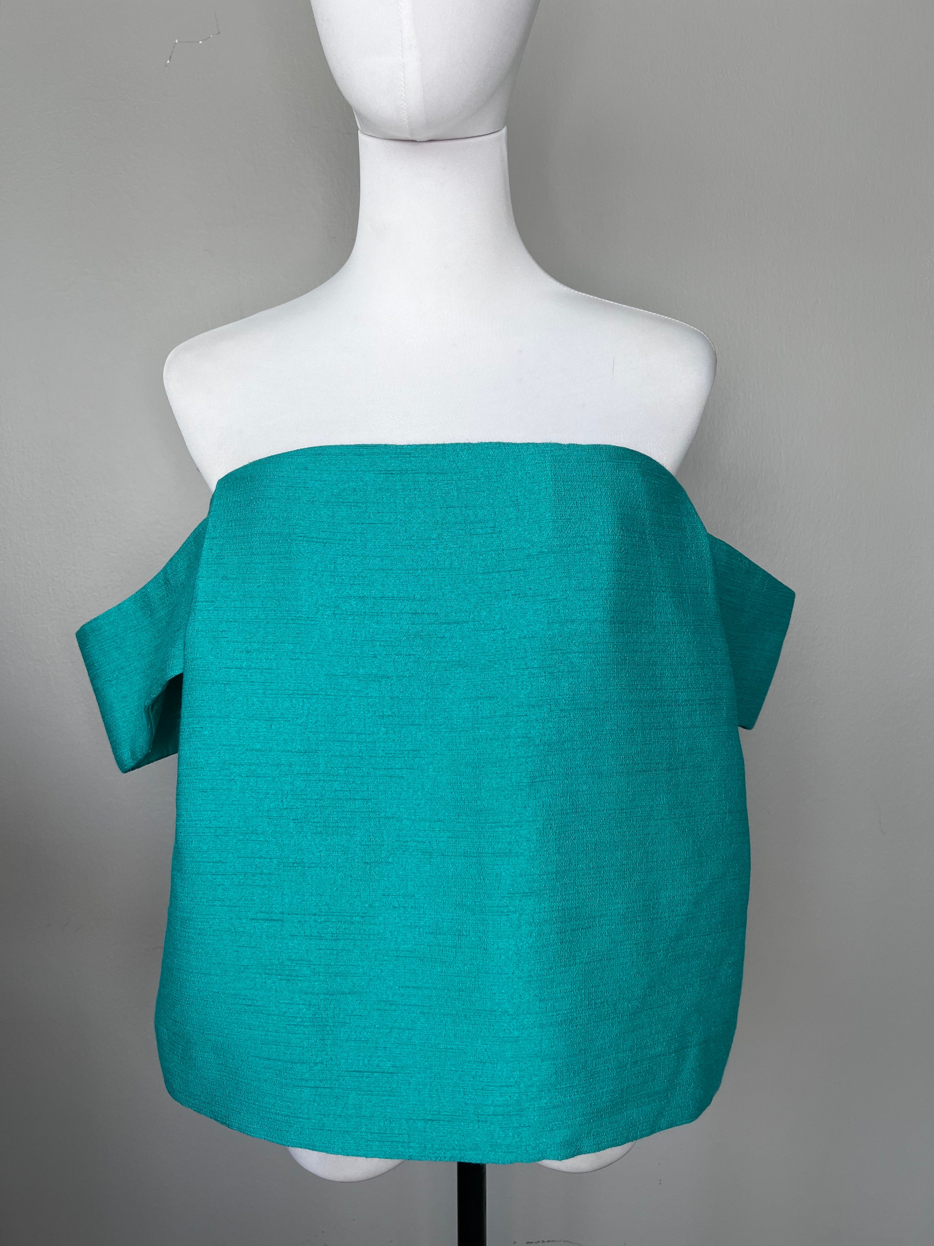 Green off-shoulder top with subtle sweetheart neckline.- C/MEO COLLECTIVE