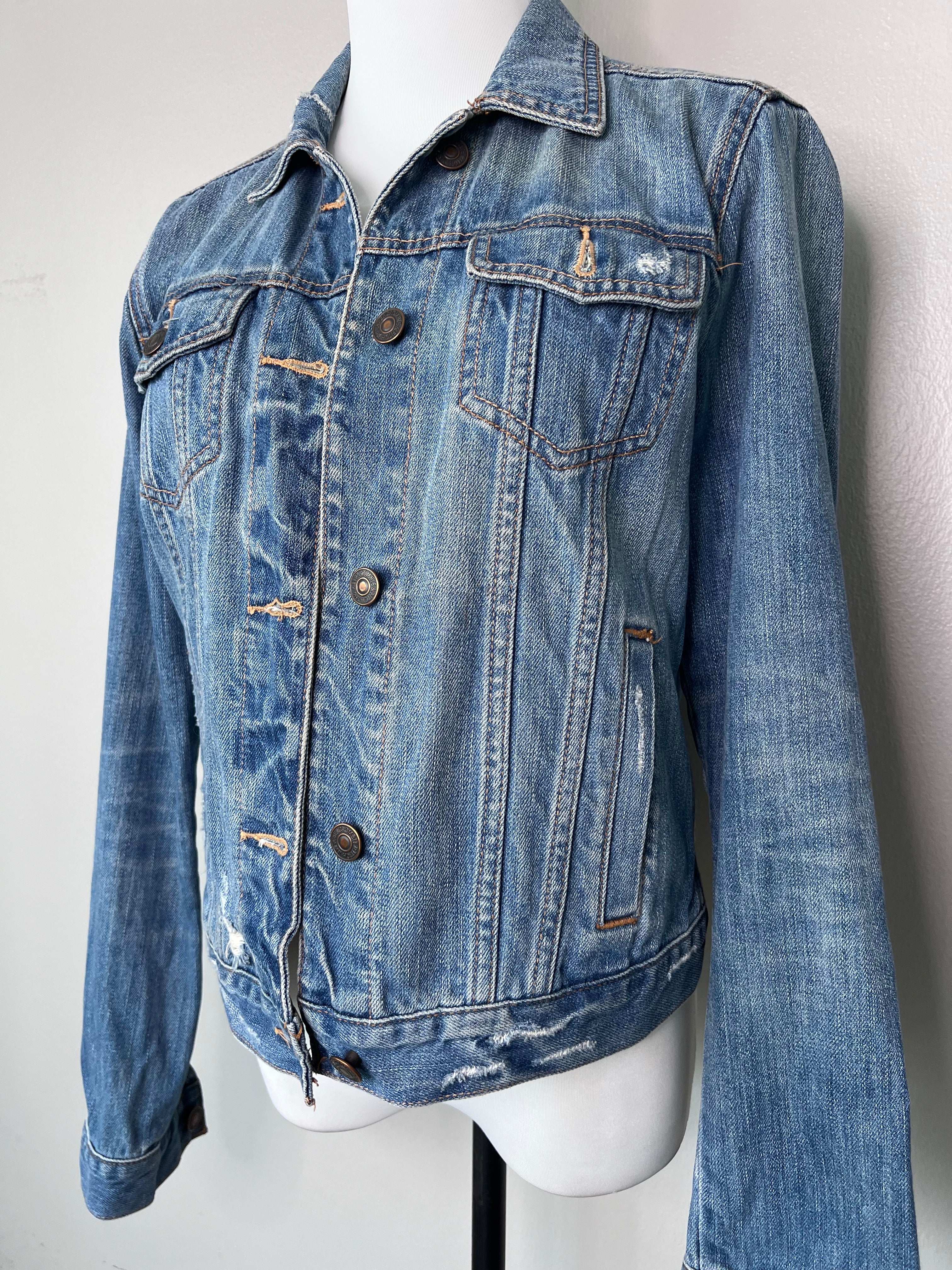 Scuffed up denim jacket with pockets in front and buttons going down along the front side. - AMBERCROMBIE & FITCH