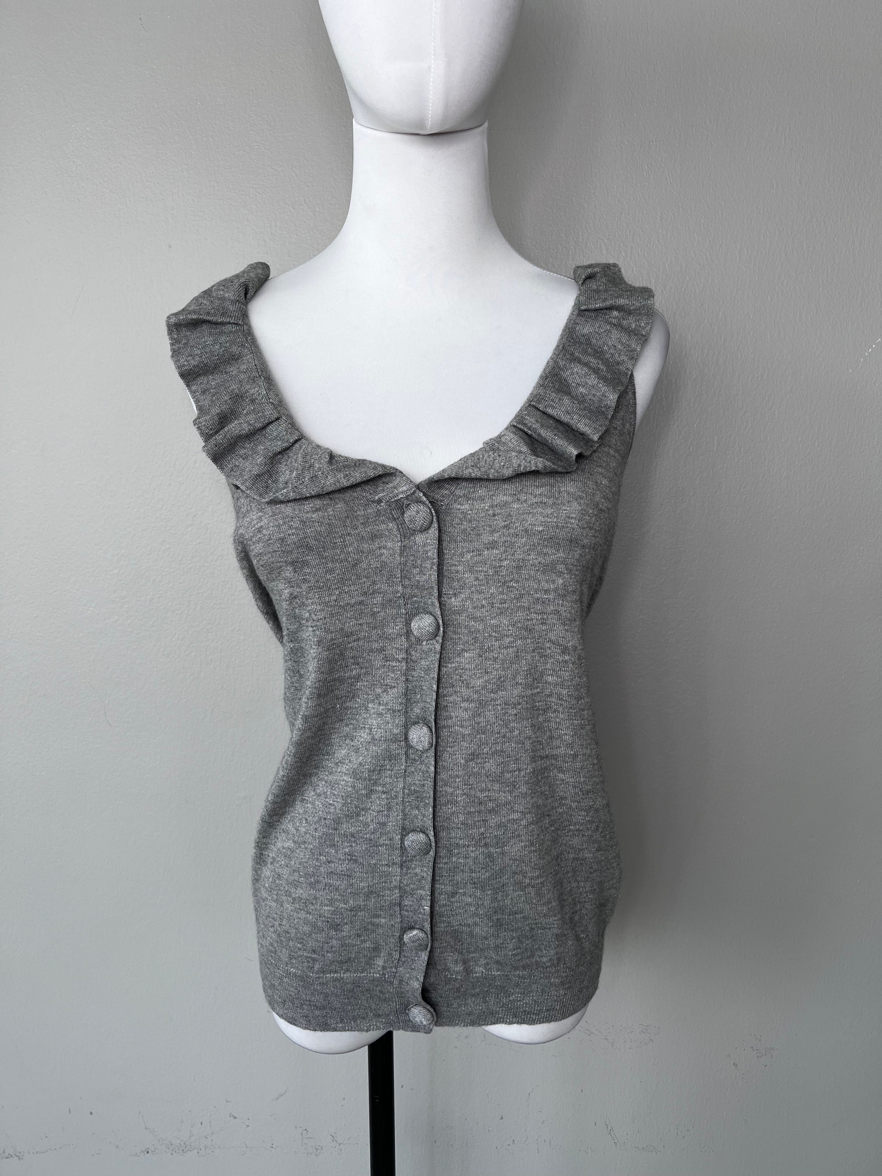 Grey cashmere tank top with big buttons going down and flowy detailing at the neckline. - MAJE