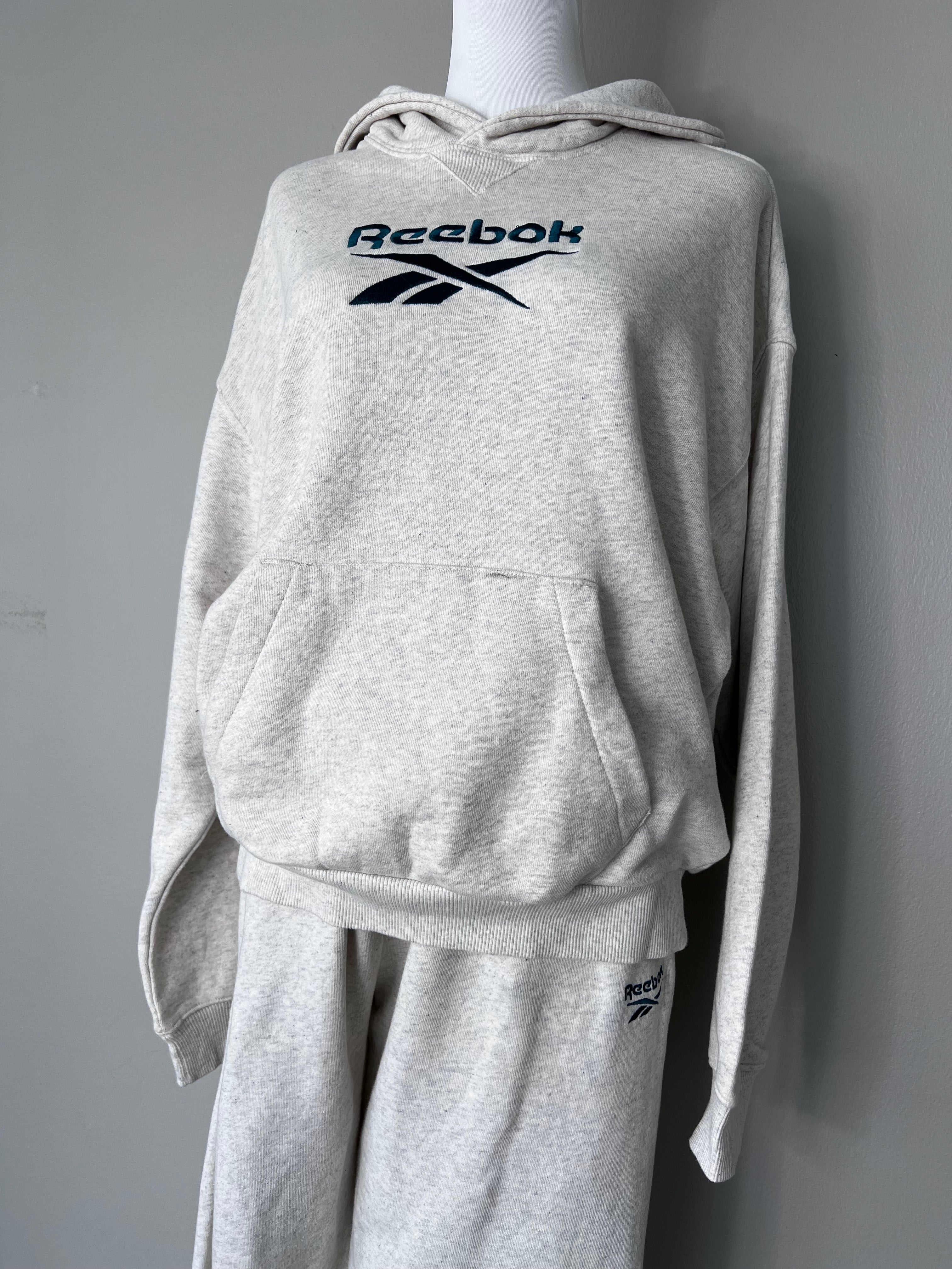 Grey sweatsuit. Hoodie with logo in the middle and matching sweatpants