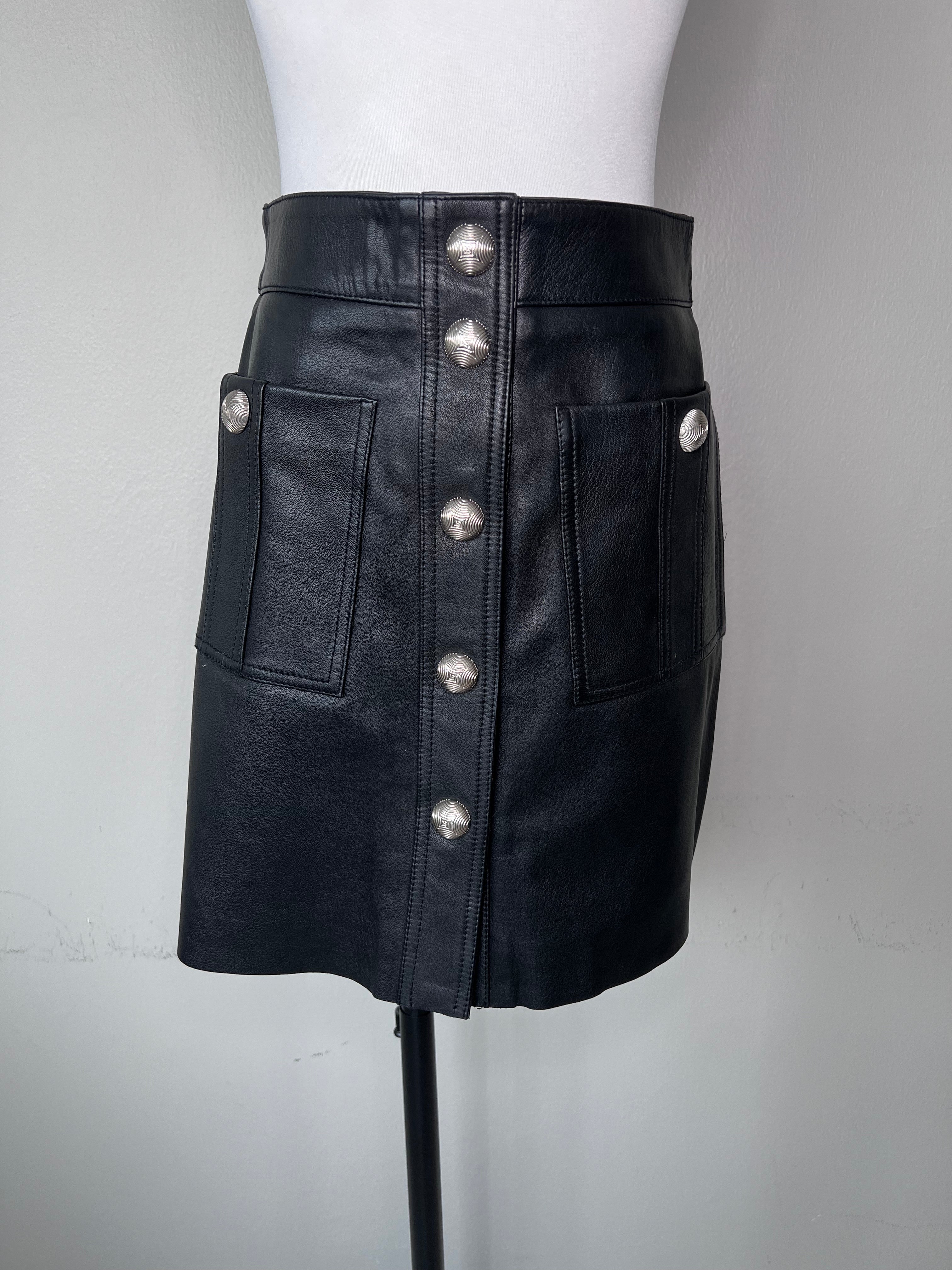 Black leather grunge style mini a-line skirt with pockets, and big silver buttons all the way down.l - MAJE