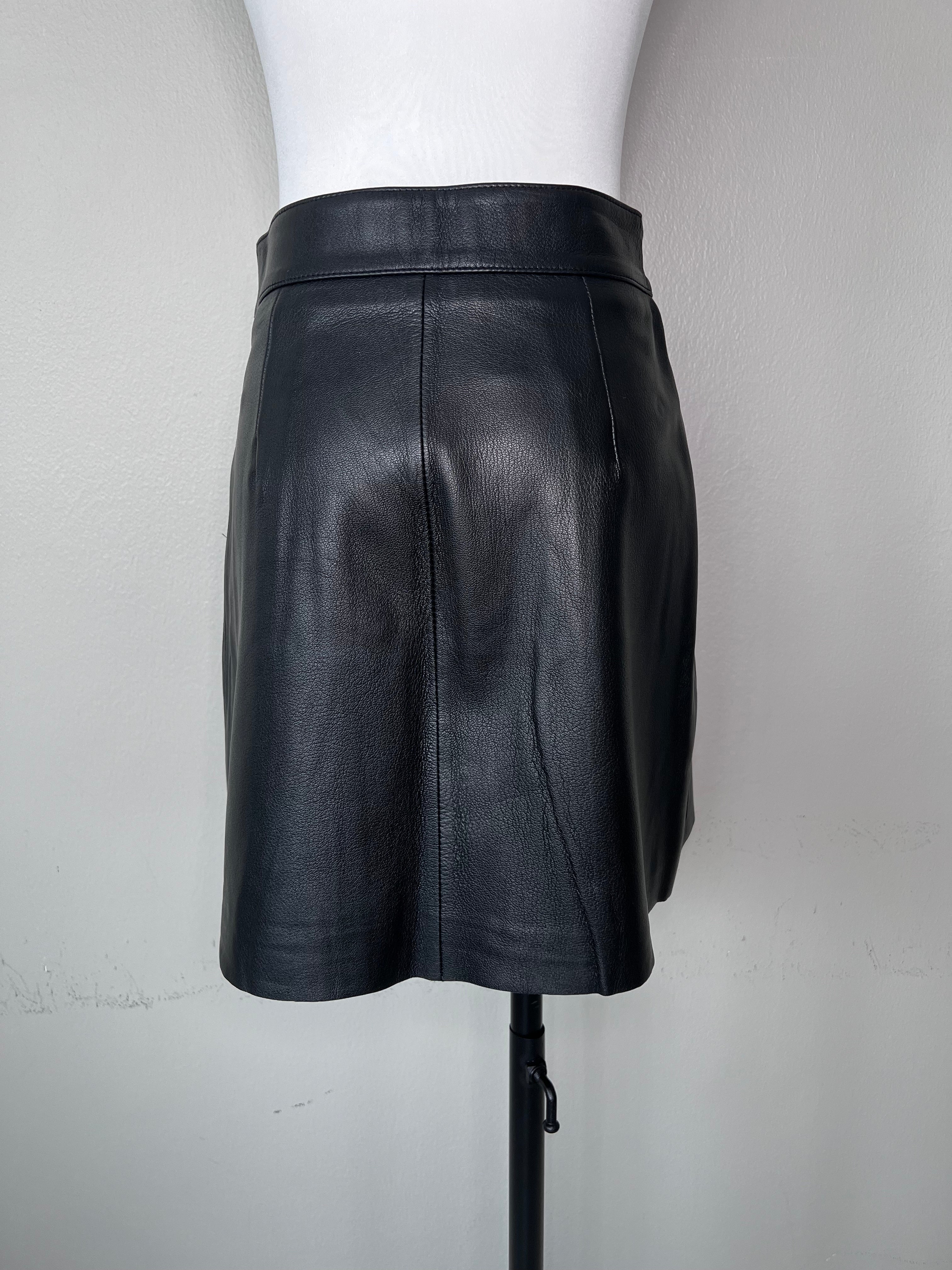 Black leather grunge style mini a-line skirt with pockets, and big silver buttons all the way down.l - MAJE
