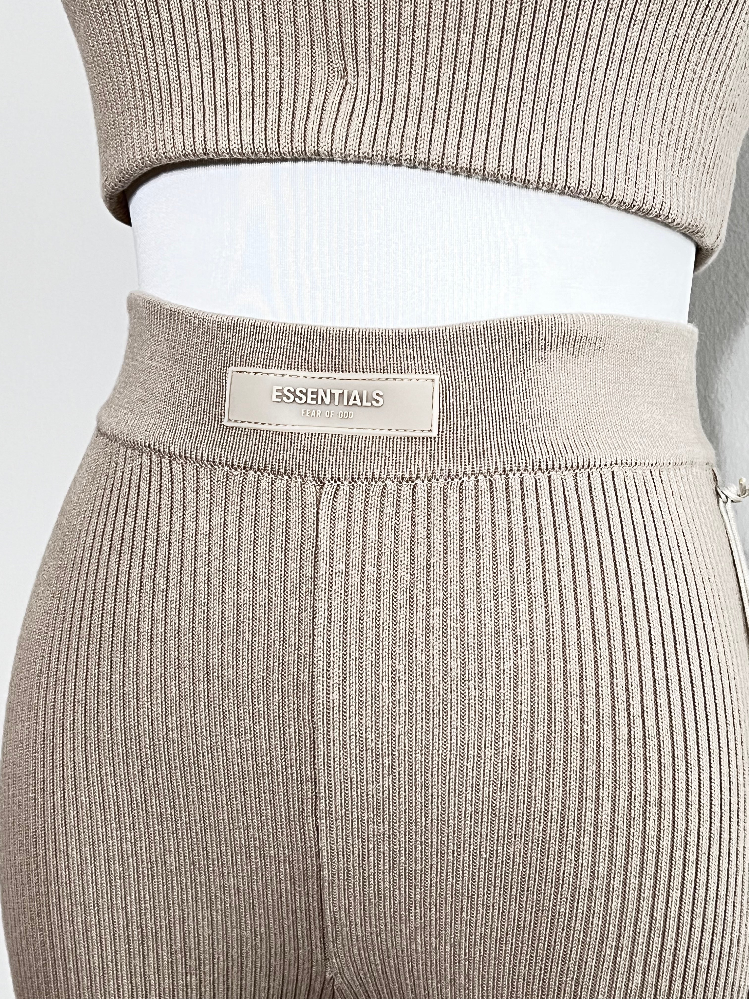 A set of knit elastic waistband with logo patch at front sports ribbed pants and sleevless crop in seal nude color - FEAR OF GOD ESSENTIALS