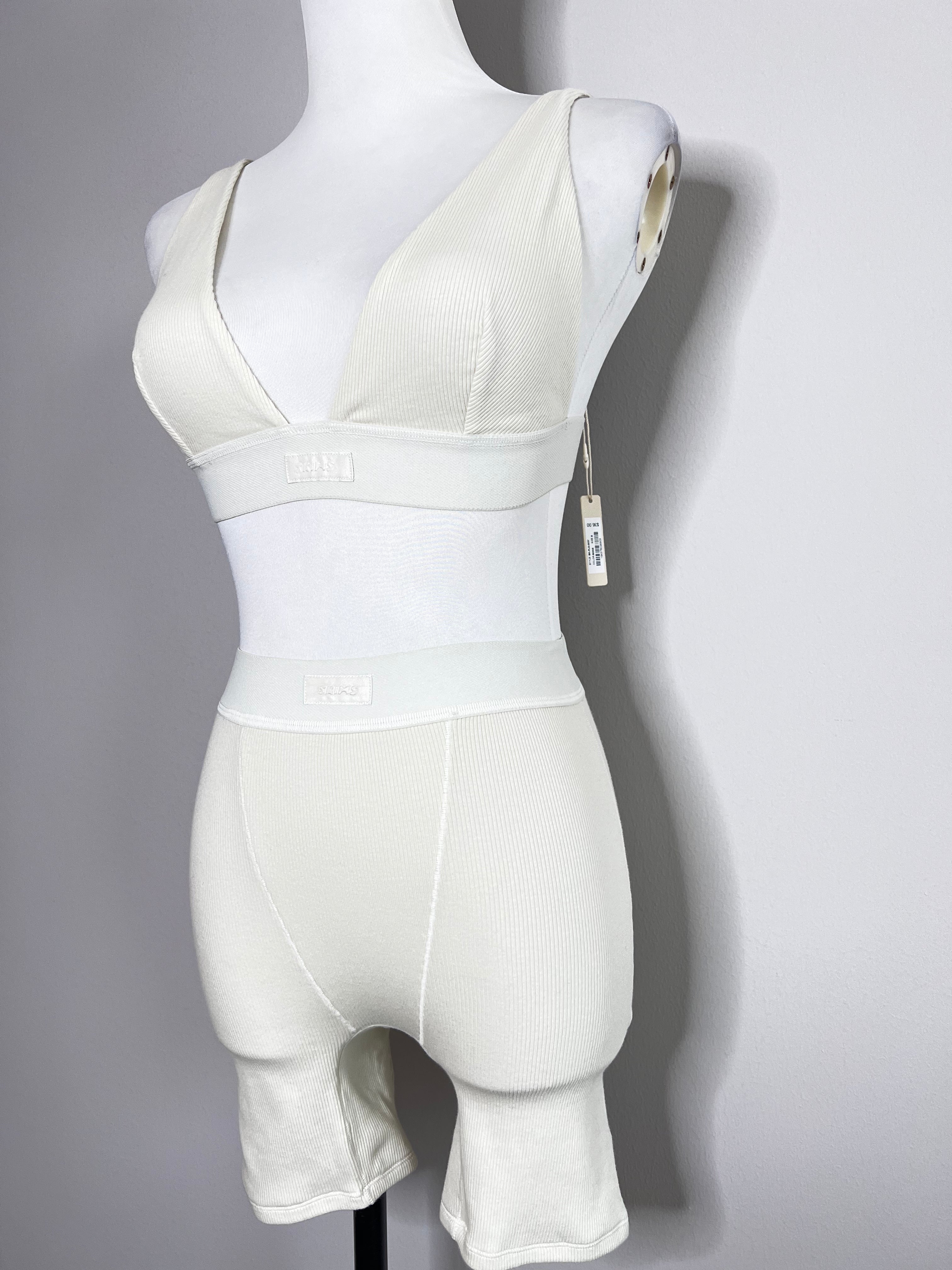 A set of cotton rib boxer shade of bone with non paded plunge bralette - SKIMS