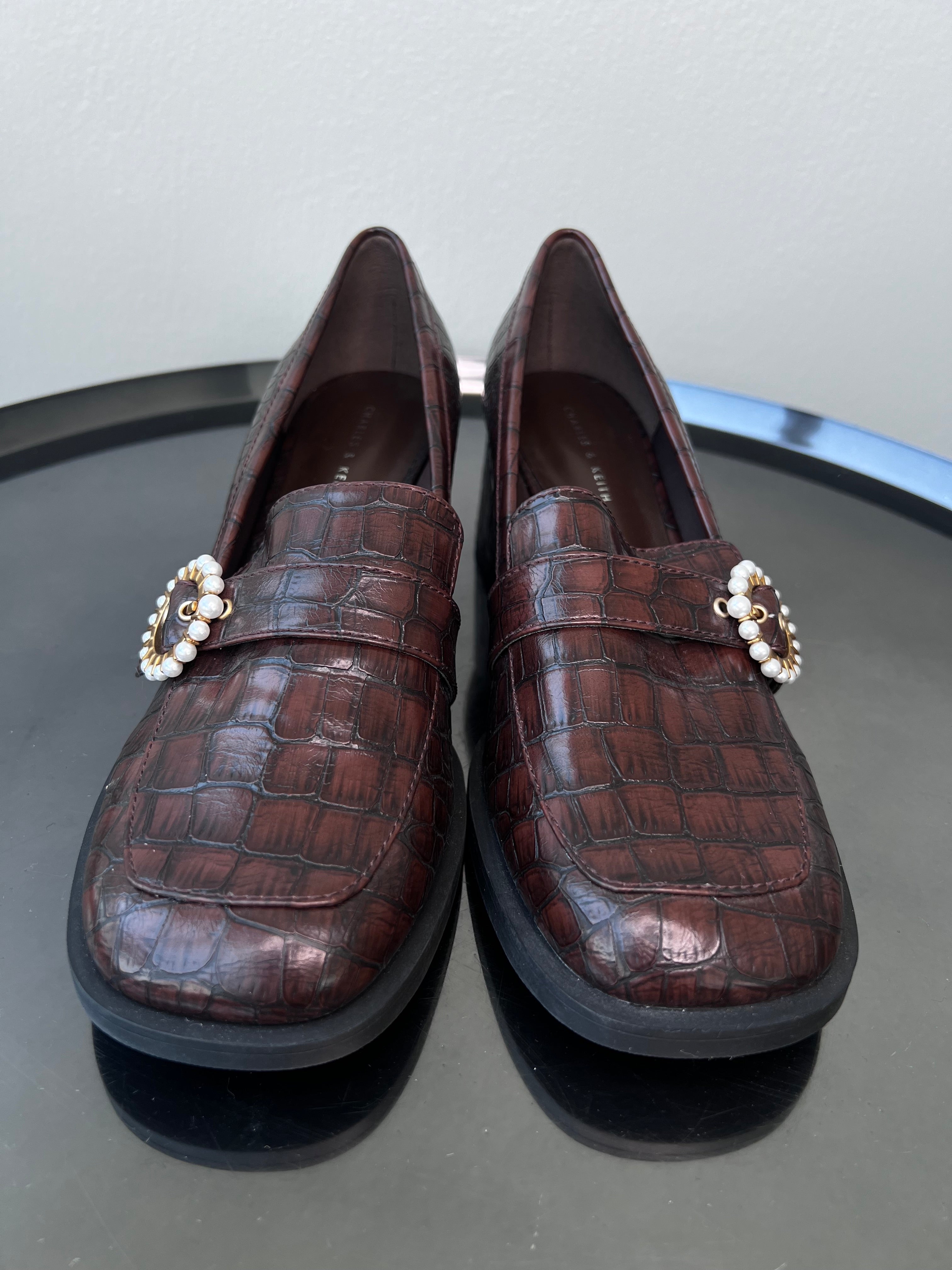 Brown leather heeled loafers with pendant. - CHARLES AND KEITH