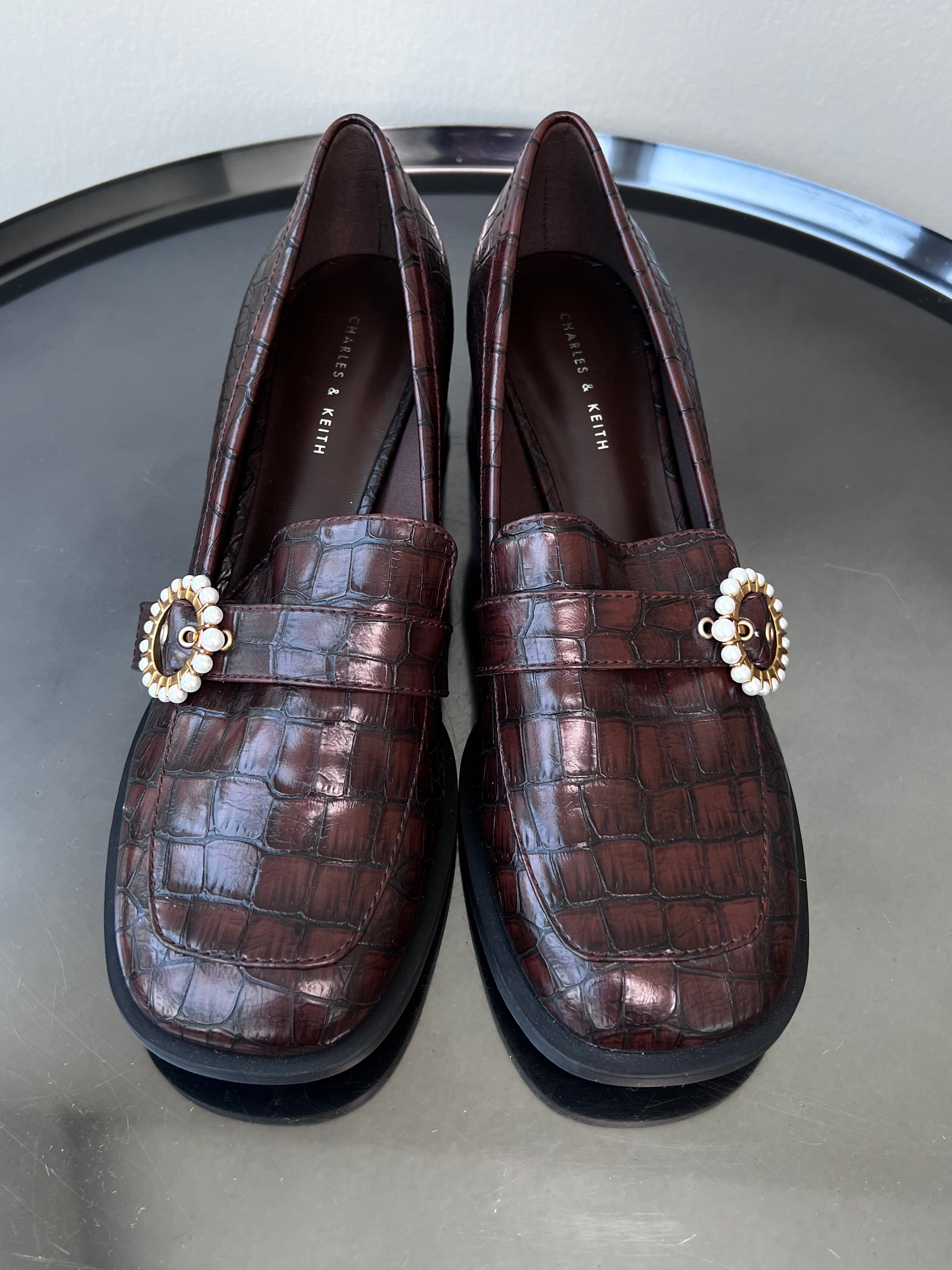 Brown leather heeled loafers with pendant. - CHARLES AND KEITH