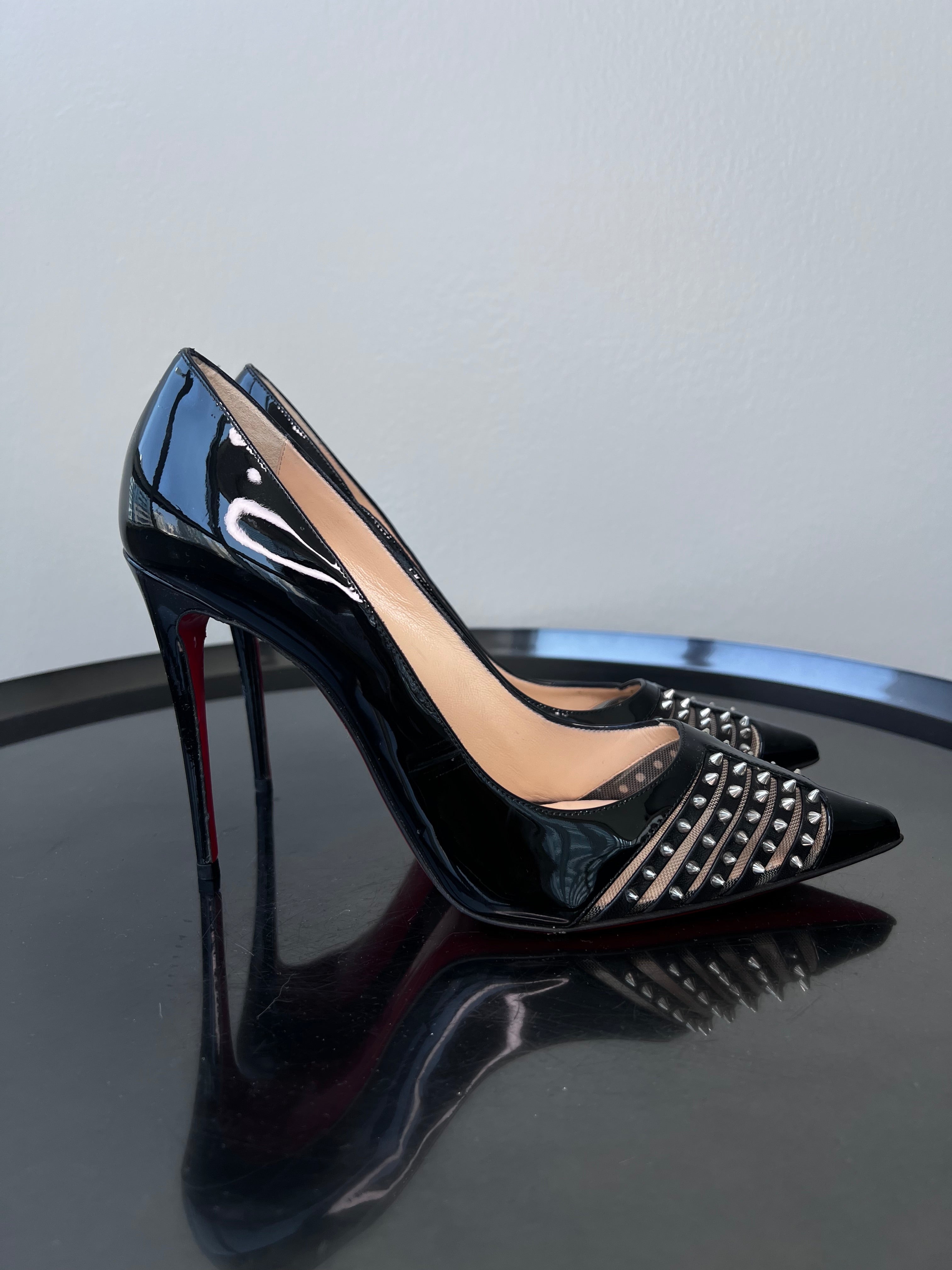 Shiny black pointed toe stiletto heel with studs at the front. - CHRISTIAN LOUBOUTIN