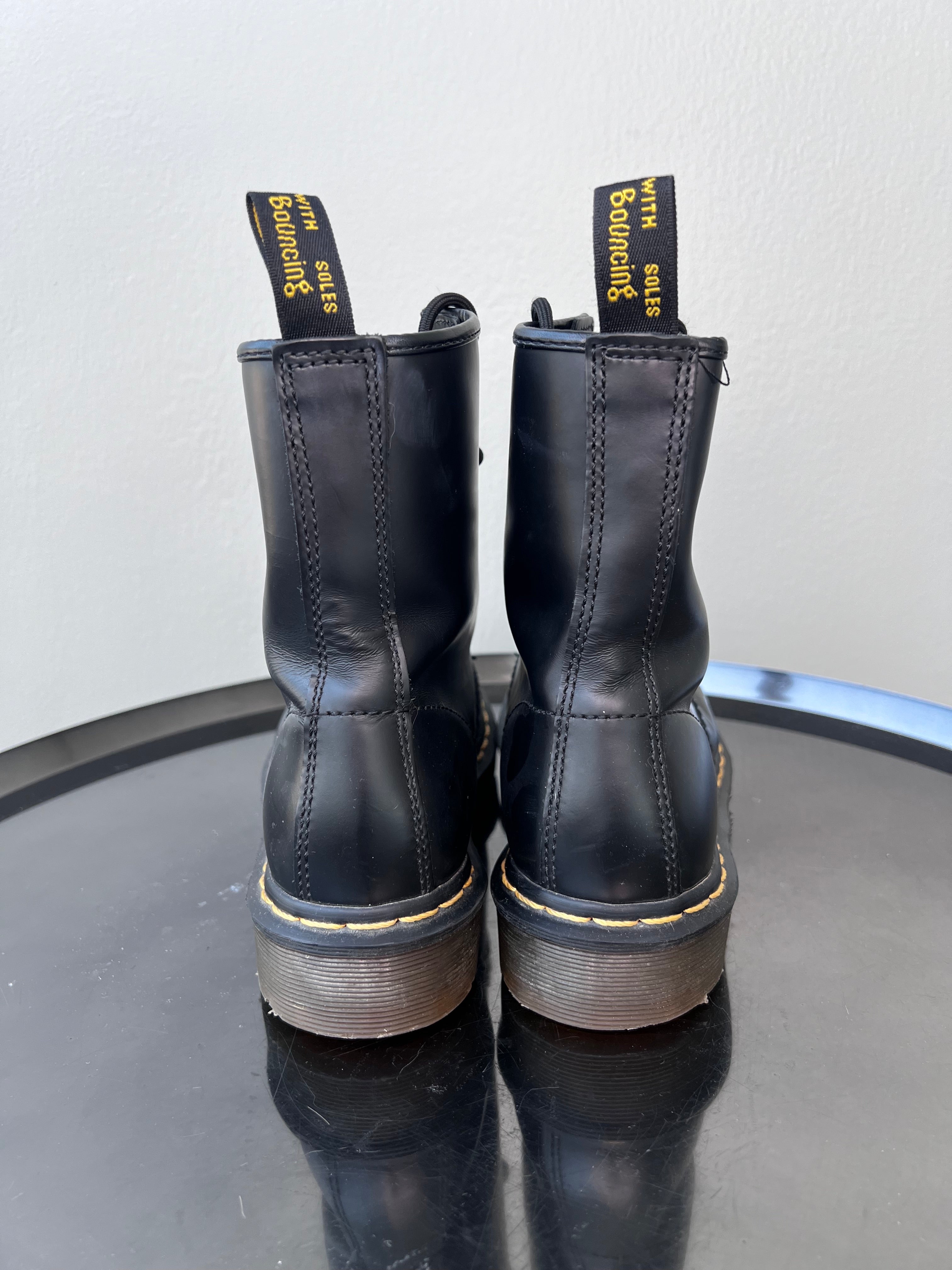 Black boots yellow top stitching