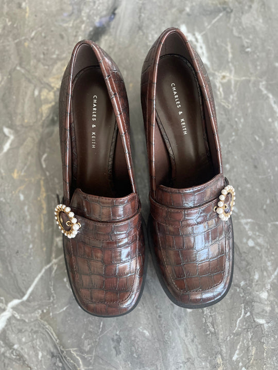 Brown leather heeled loafers with pendant. - CHARLES AND KEITH